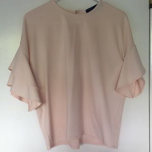 Polyester light peach ruffle blouse